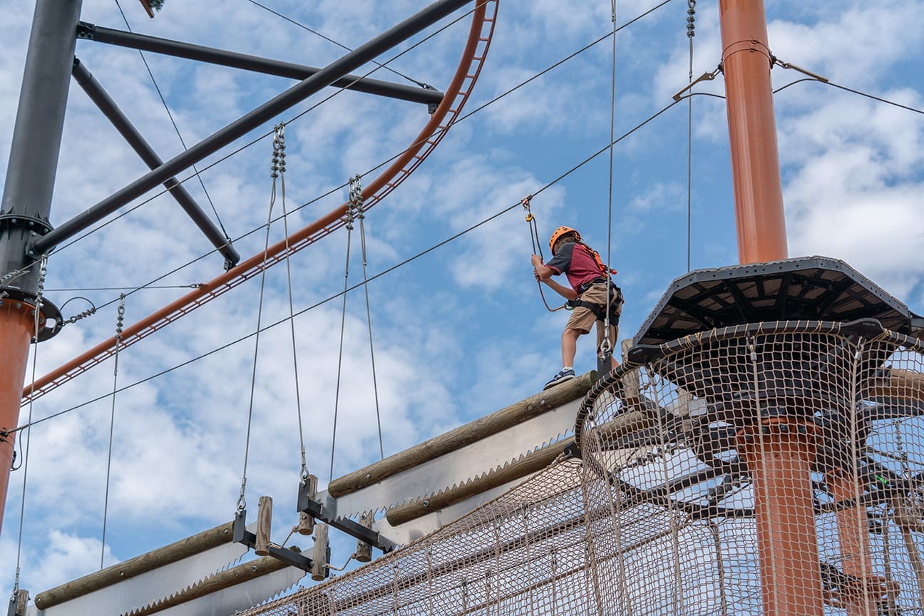 boy doing obstacle course at Paula Deen’s Lumberjack Feud